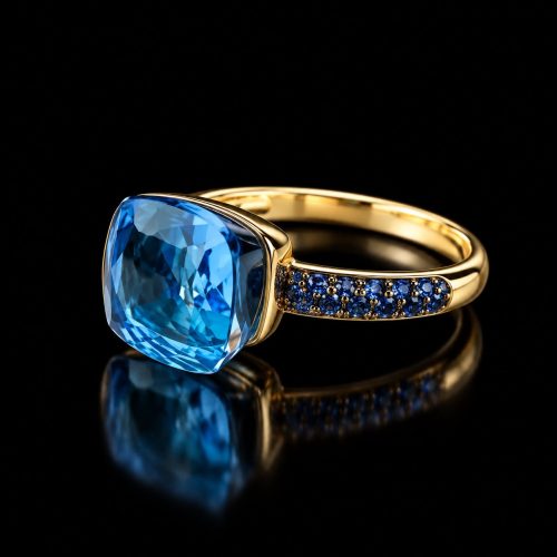 Ring in roos goud gezet met blauwe topaas en blauwe saffier