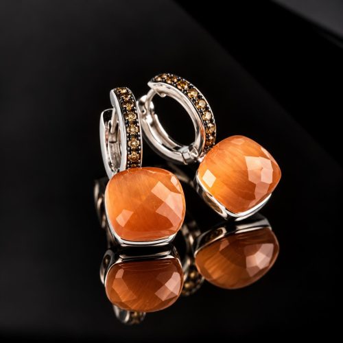 Zilveren oorringen oorbellen model pomellato gezet met oranje steen