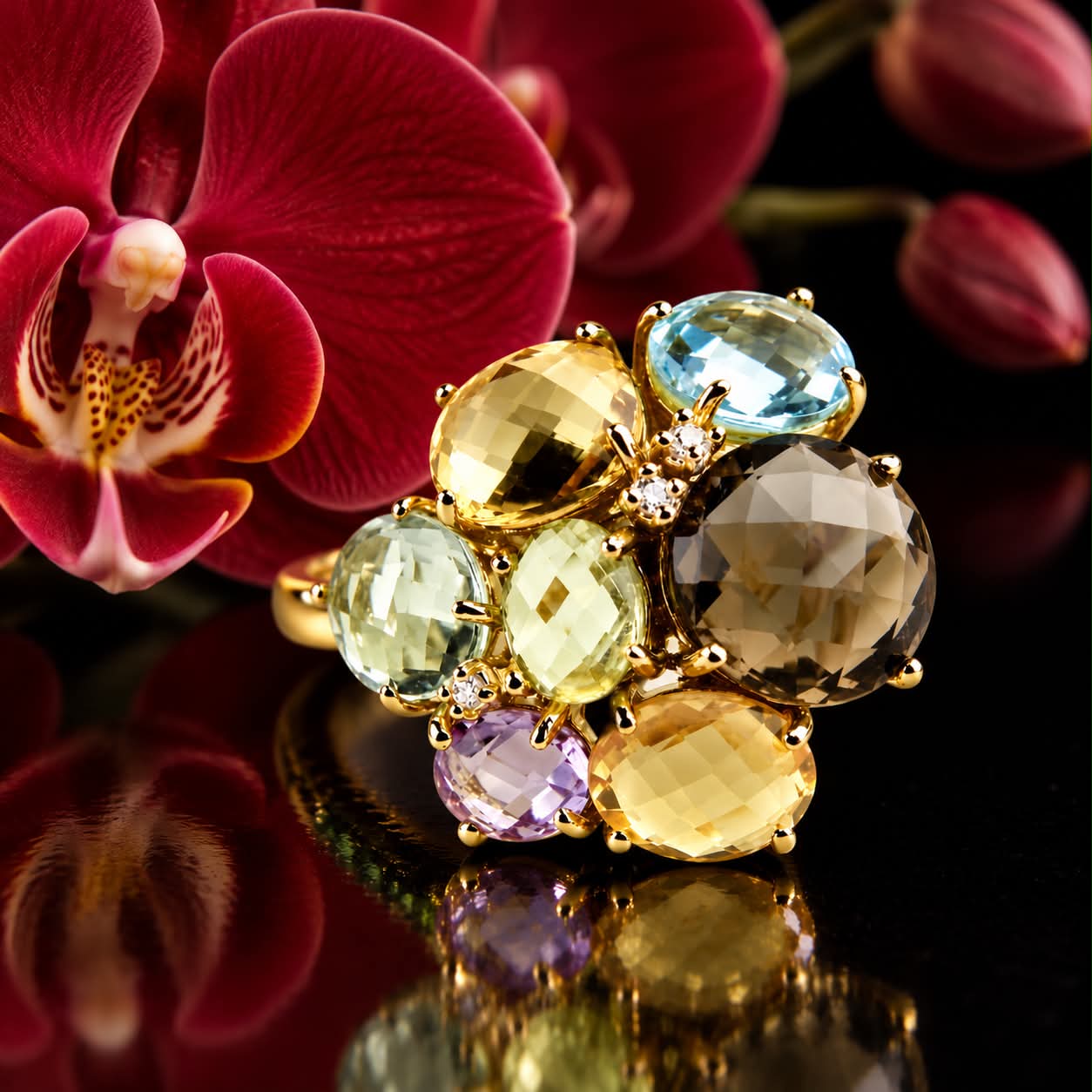 Grote ring in geel goud met verschillende edelstenen en diamant
