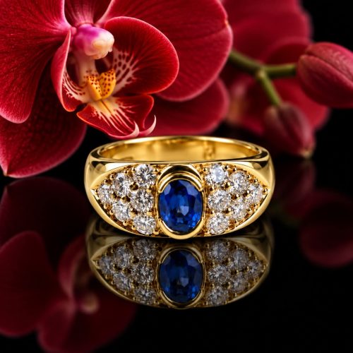 ring in geel goud gezet met diamant en saffier