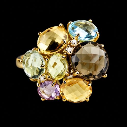 Grote ring in geel goud met verschillende edelstenen en diamant