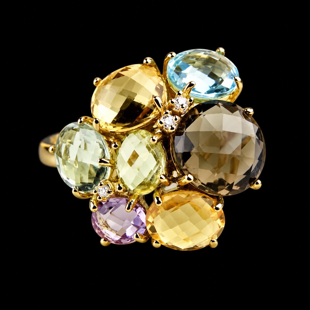 Grote ring in geel goud met verschillende edelstenen en diamant