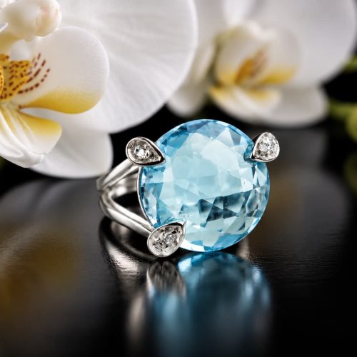 Ring in wit goud gezet met blauwe topaas en diamant