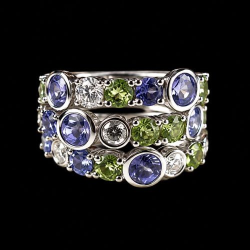 ringen in wit goud gezet met diamant peridoot en blauwe spinel