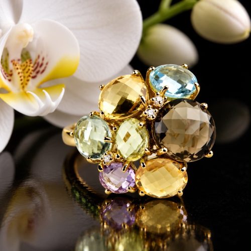 Grote ring in geel goud met verschillende edelstenen en diamant