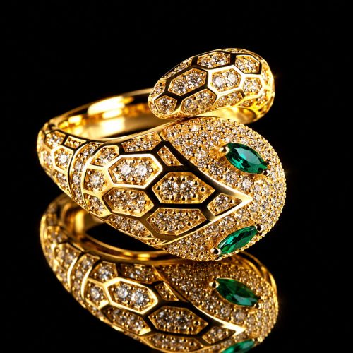 Zilveren ring geelgoud verguld slangenkop met groene stenen en cubic zirconia