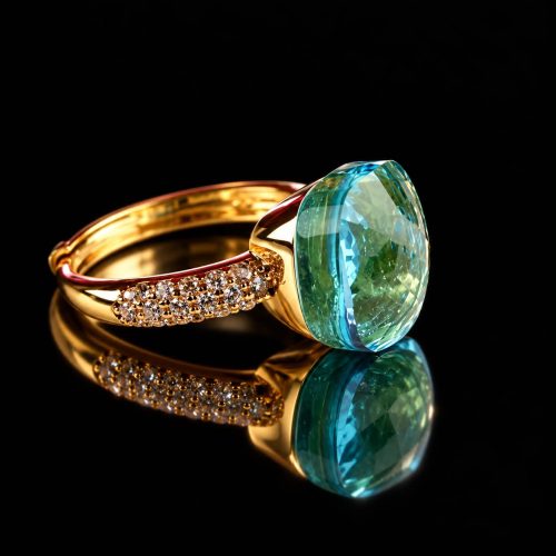 Ring in zilver geelgoud verguld model Pomellato met licht blauwe steen en cubic zirconia