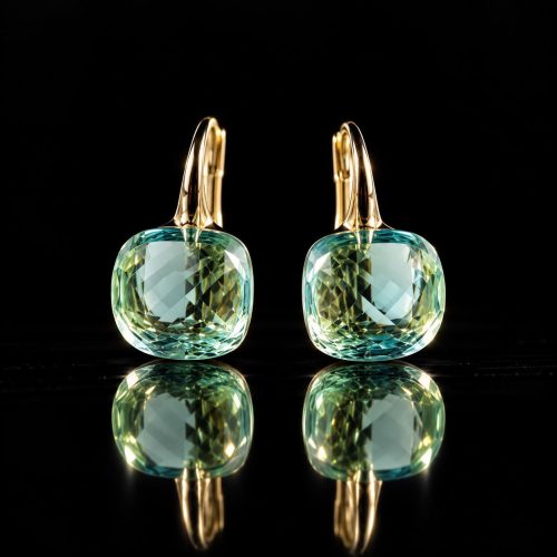 Zilveren oorringen oorbellen geelgoud verguld model pomellato met licht blauwe steen
