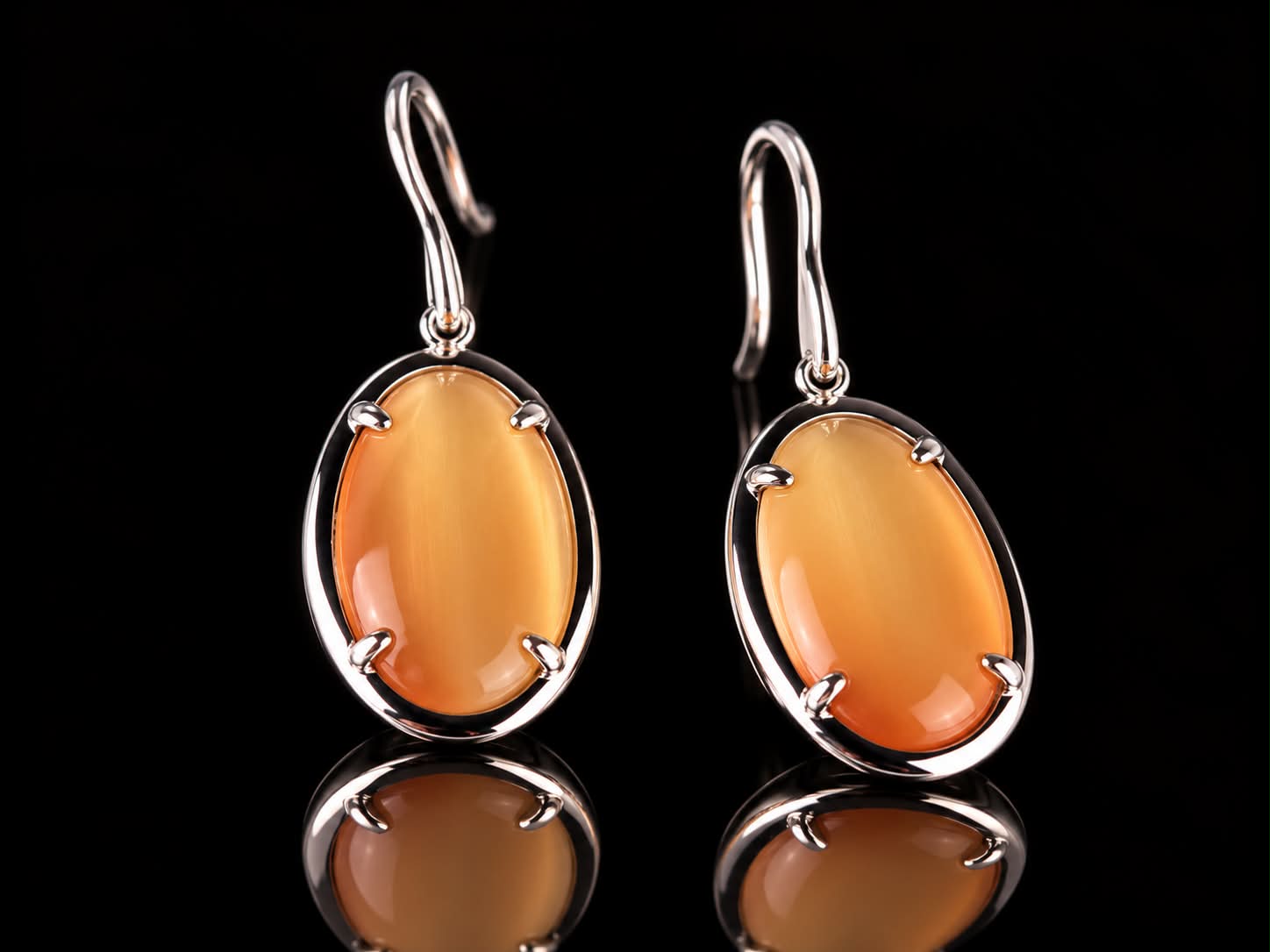 Zilveren oorringen oorbellen Model Oval met oranje stenen