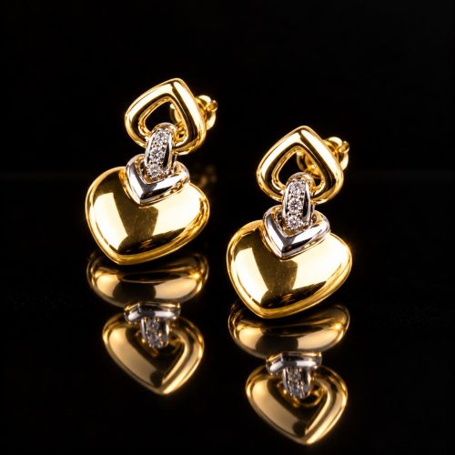 oorringen in geel en wit goud gezet met diamant