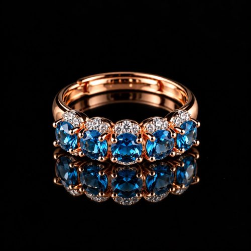 Ring in zilver roos goud verguld gezet met blauwe stenen en cubic zirconia