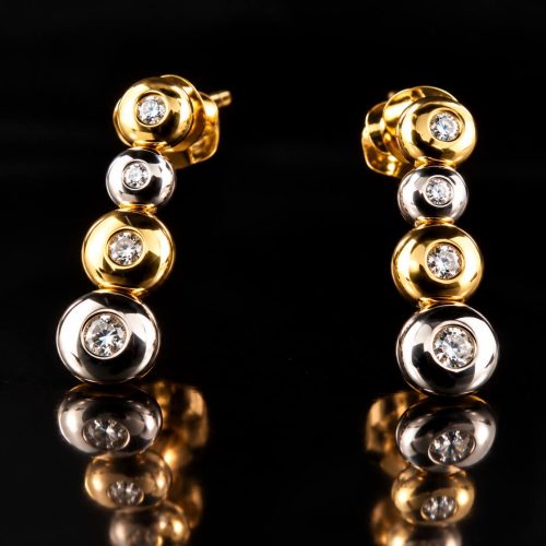 oorringen in geel en wit goud gezet met diamant