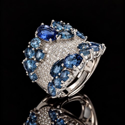 Brede zilveren ring blauwe stenen en cubic zirconia